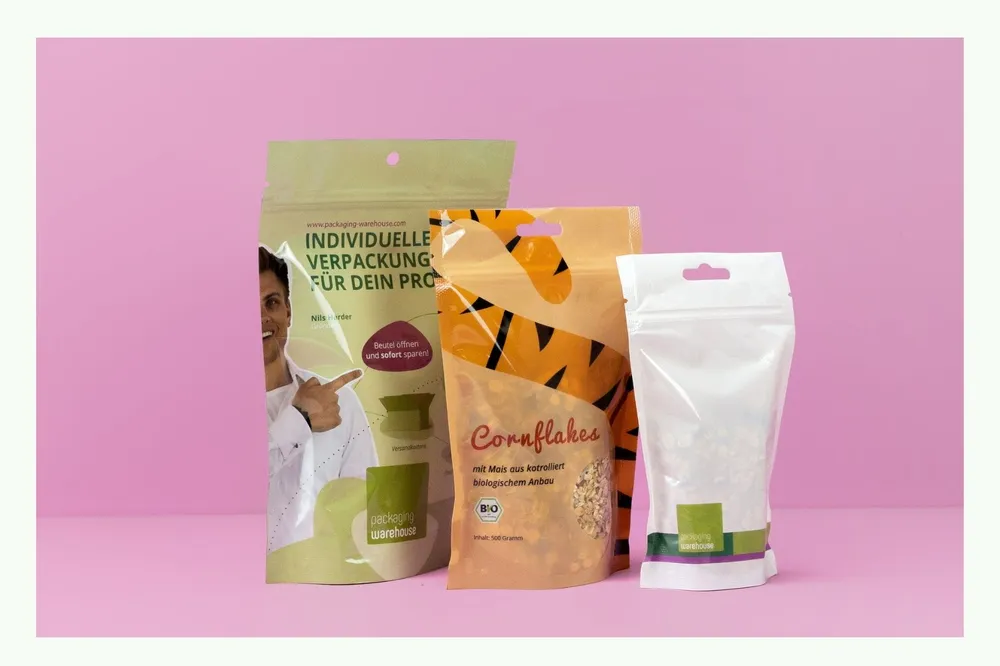 Various colourful stand-up pouches against pink background Various colourful stand-up pouches against pink background